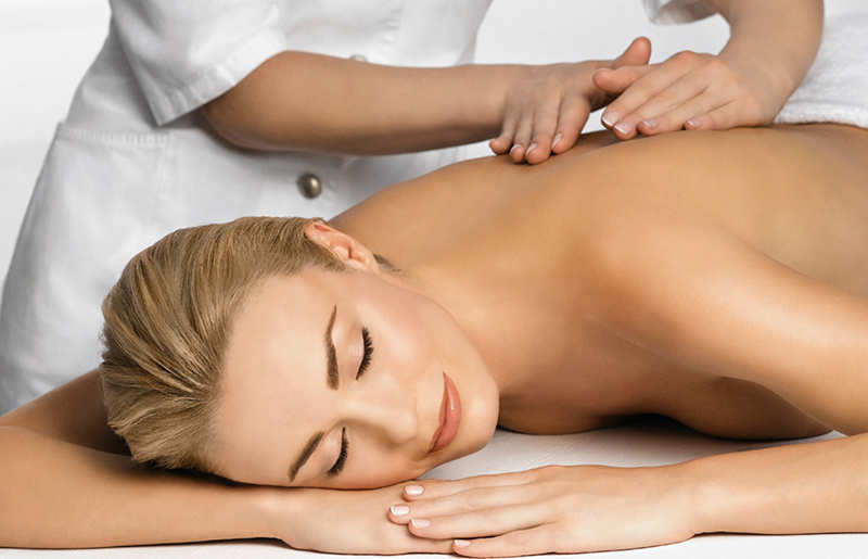 healthy young woman receiving massage